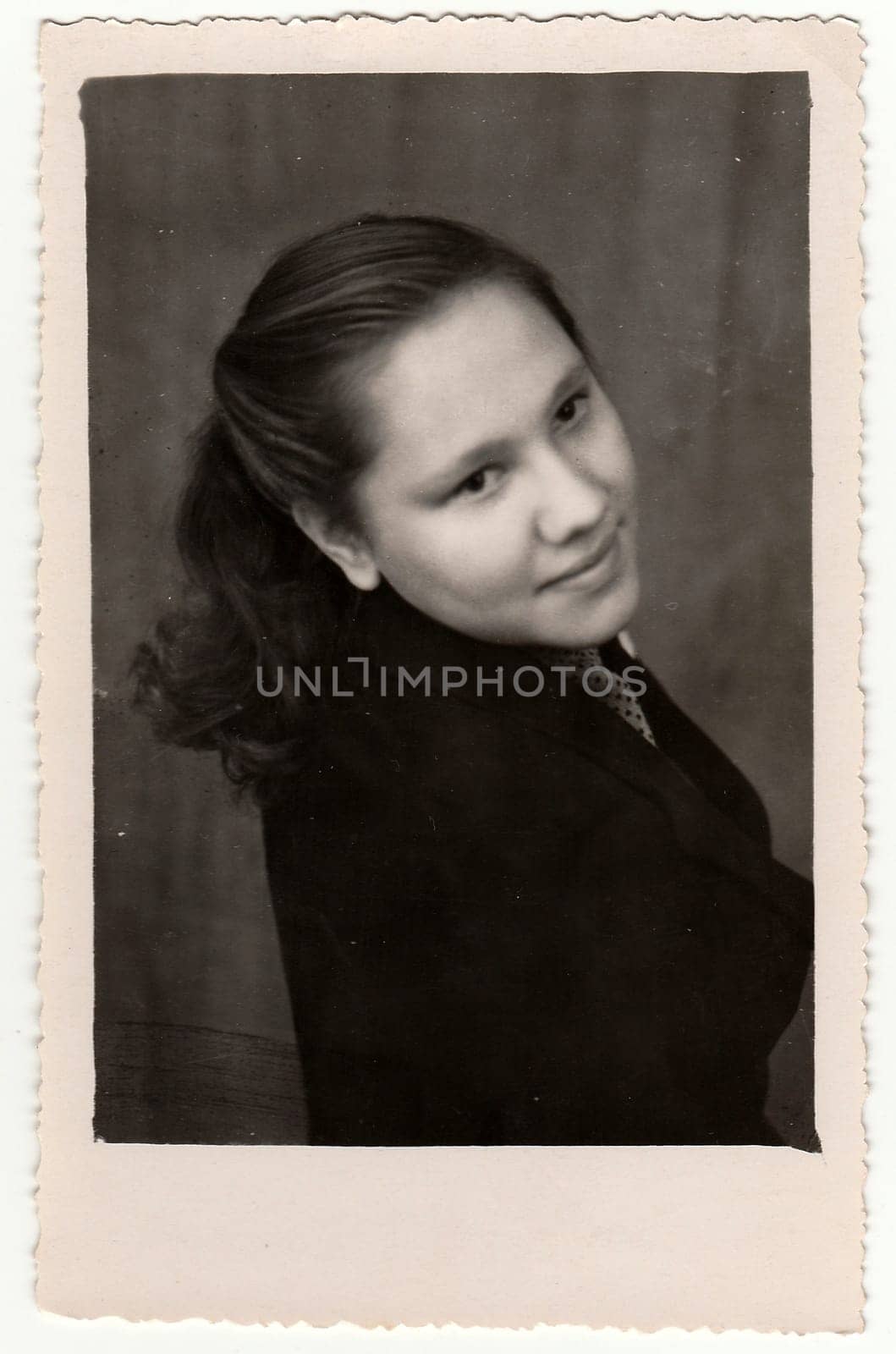 USSR - CIRCA 1960s: Vintage portrait shows a young woman. Black & white antique photo.