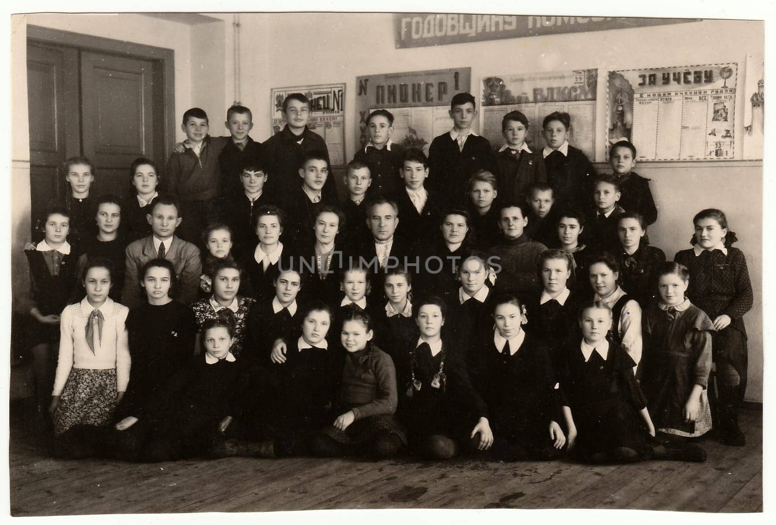 USSR - CIRCA 1950S: Vintage photo shows pupils (schoolmates) and teaching staff.