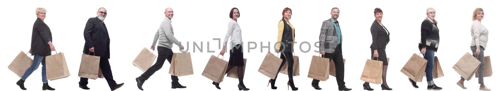 a line of people with shopping bags. side view by asdf