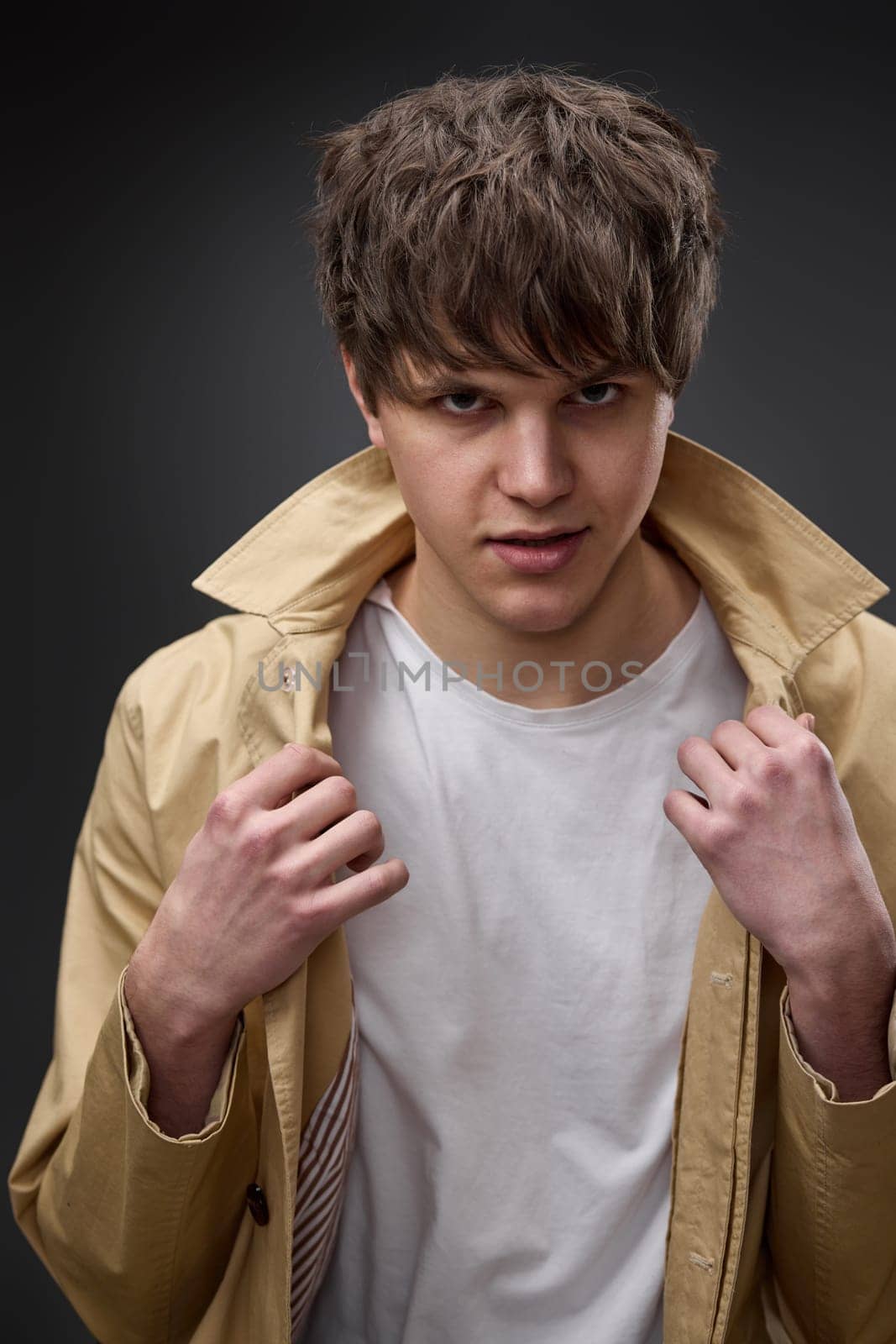 portrait of caucasian man with hairstyle in coat by erstudio