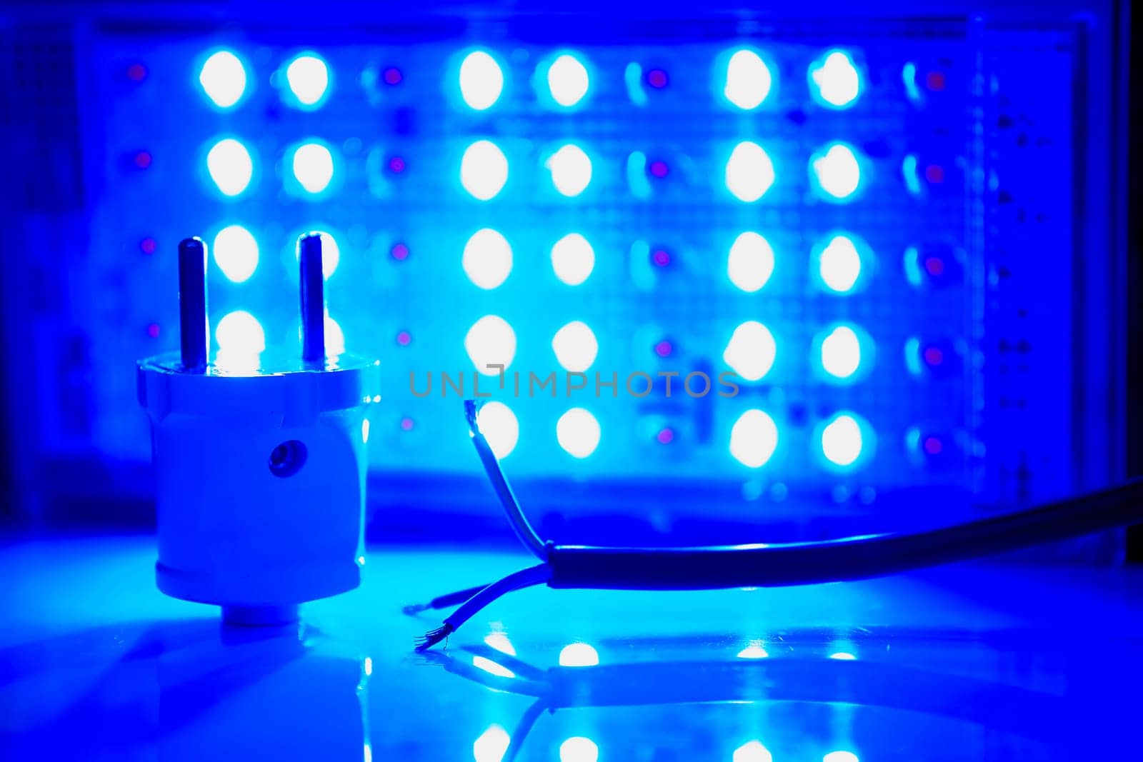 a semiconductor diode which glows when a voltage is applied. Electrical equipment for connection. Three core electric cable and lighting LED lamp.