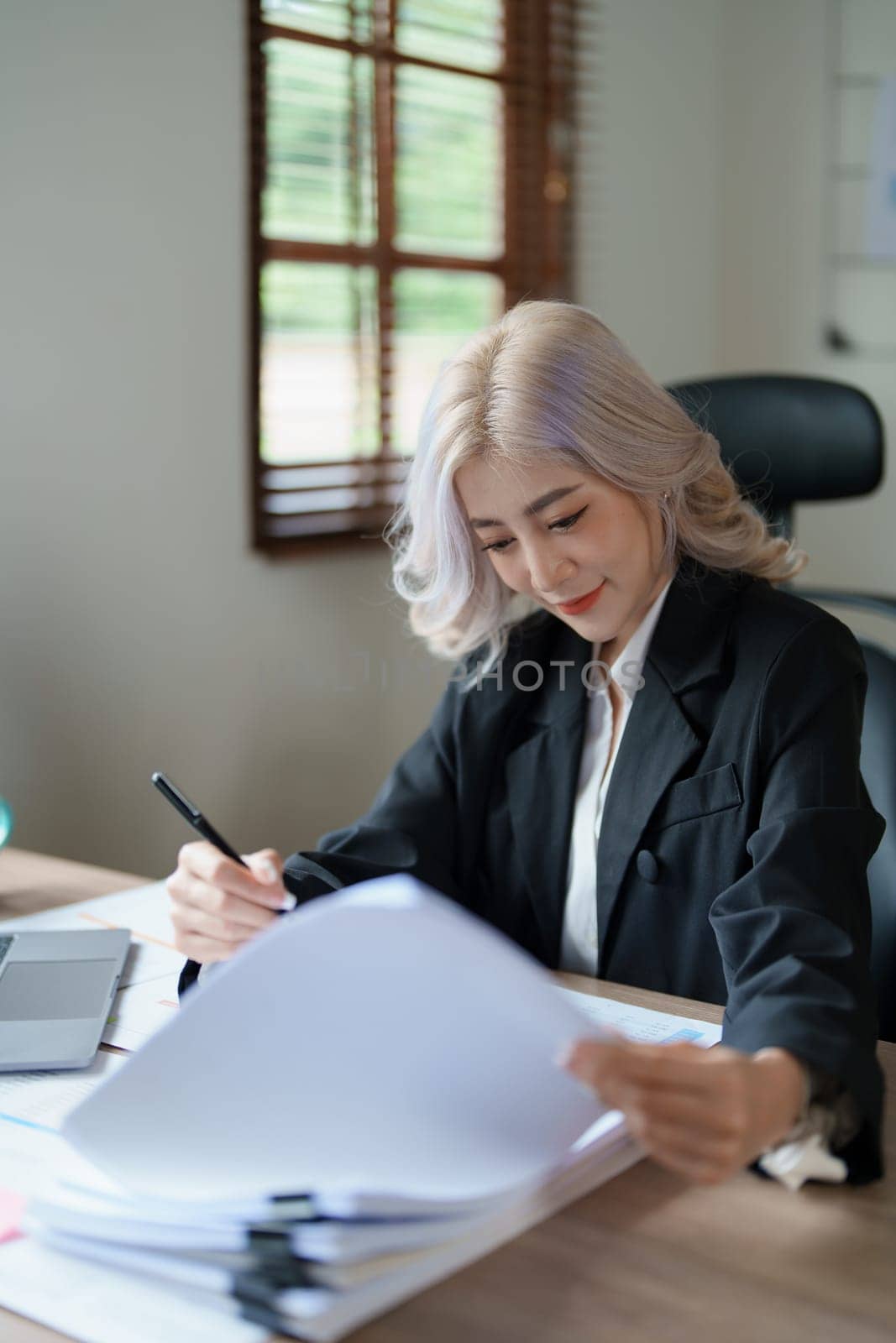 financial, Planning, Marketing and Accounting, portrait of Asian employee checking financial statements using documents and calculators at work..