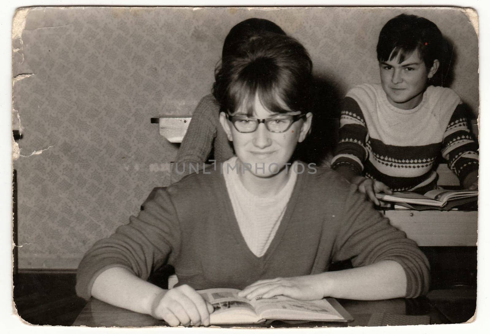 THE CZECHOSLOVAK SOCIALIST REPUBLIC - CIRCA 1960s: Vintage photo shows female pupil at the desk in the classroom.