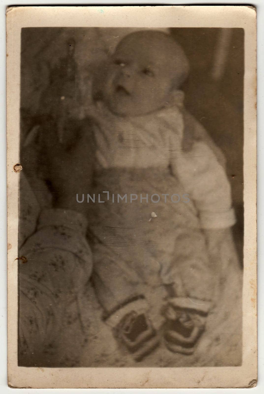 Vintage photo shows baby boy. by roman_nerud