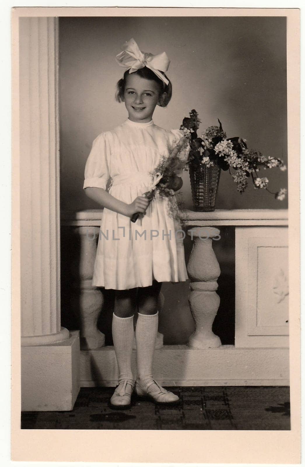 HODONIN, THE CZECHOSLOVAK REPUBLIC - CIRCA 1945: A vintage photo of the young girl - the first holy communion.