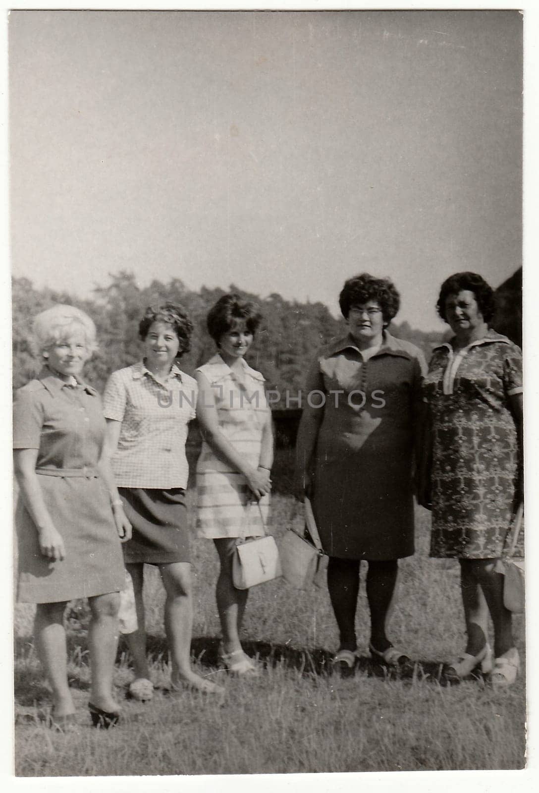 Vintage photo shows women outdoors. by roman_nerud