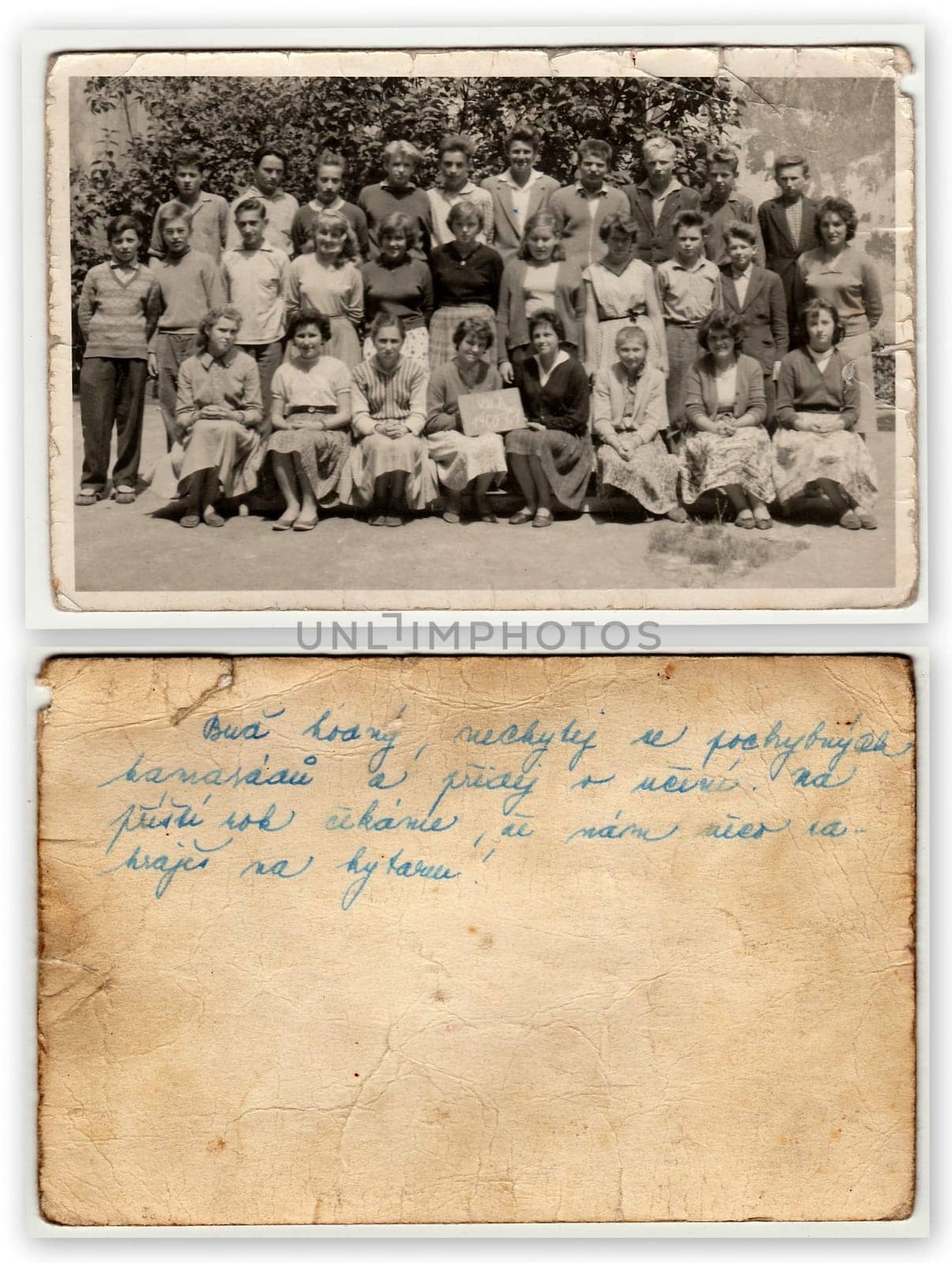 Front and back of photo. A vintage photo shows schoolmates with female teacher. by roman_nerud