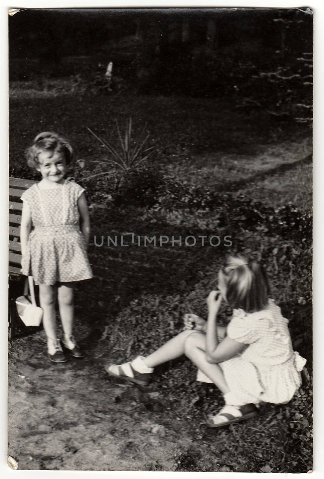 THE CZECHOSLOVAK SOCIALIST REPUBLIC - CIRCA 1950s: A vintage photo shows small girls outdoors.