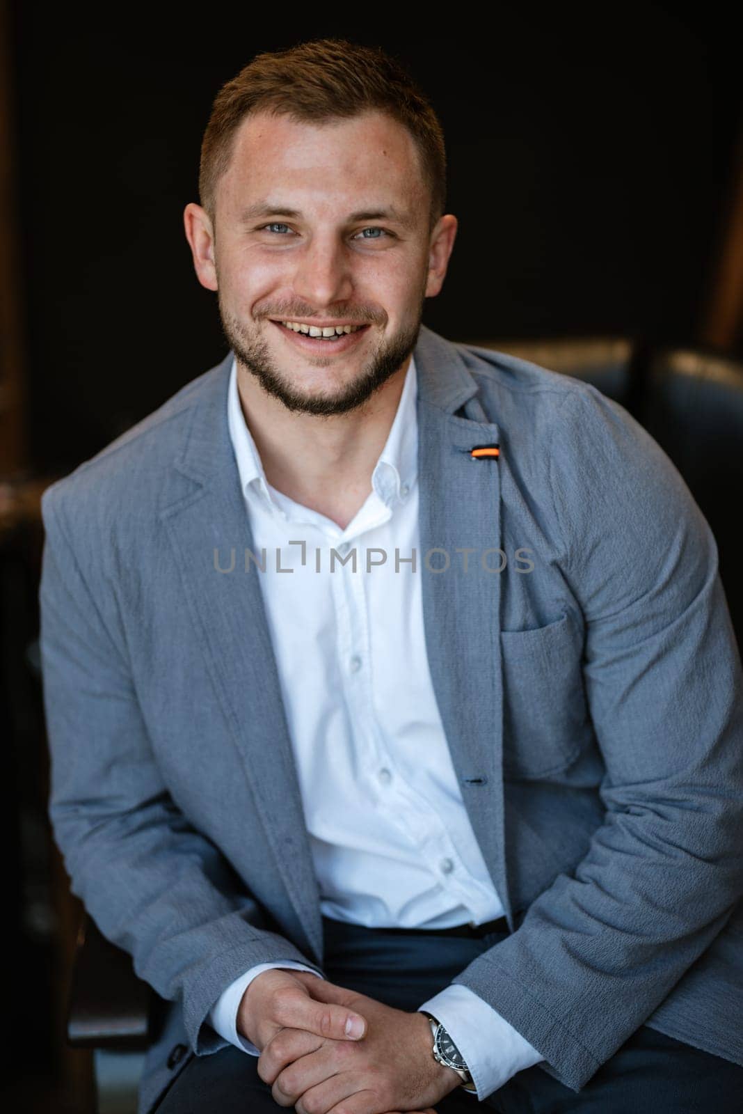 portrait of a young guy groom at the training camp in the barbershop by Andreua