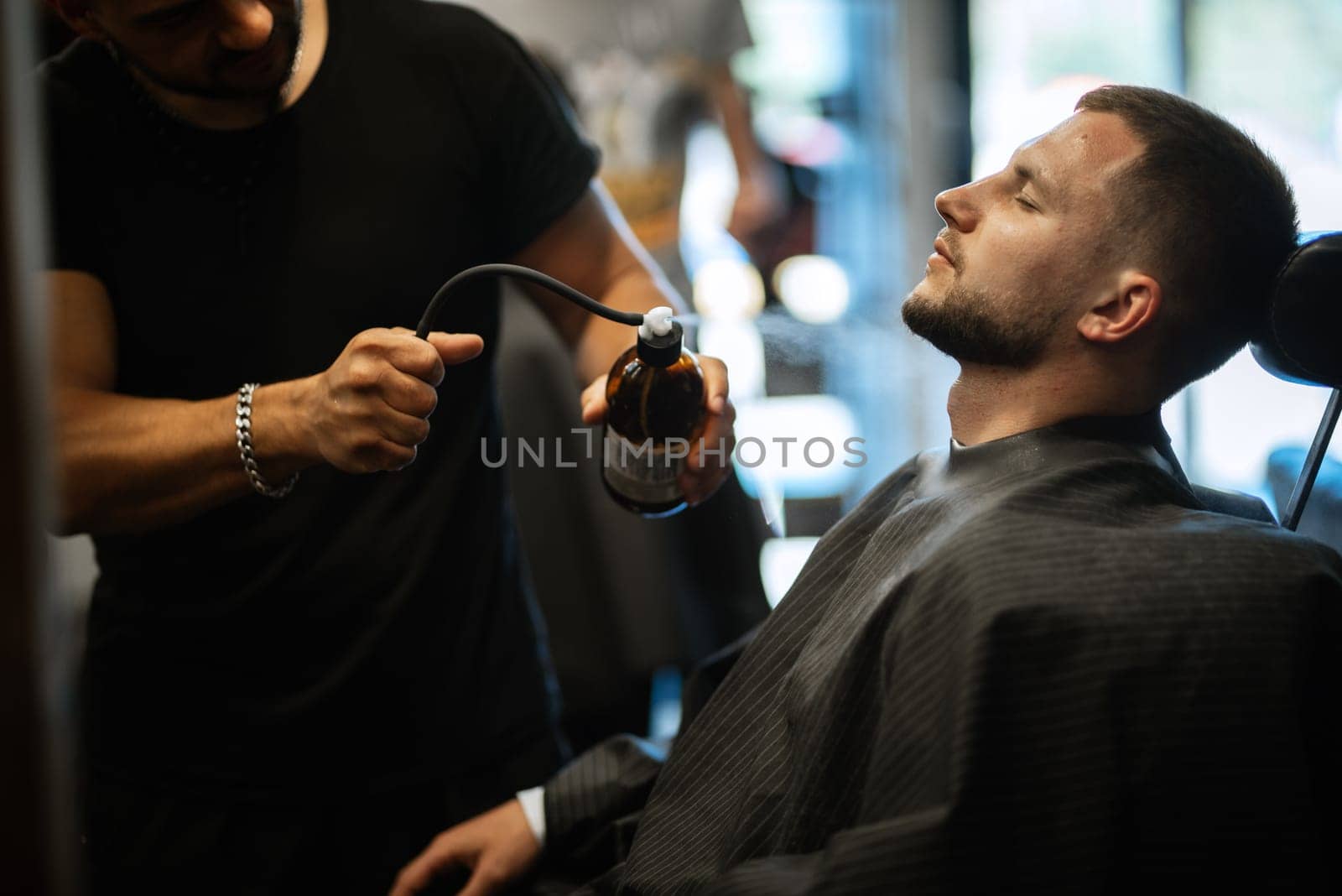 portrait of a young guy groom at the training camp in the barbershop by Andreua