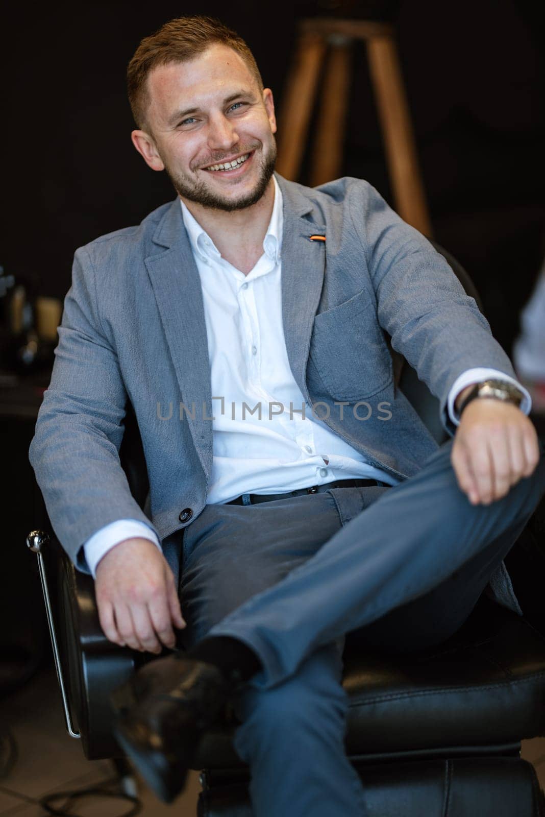 portrait of a young guy groom at the training camp in the barbershop by Andreua