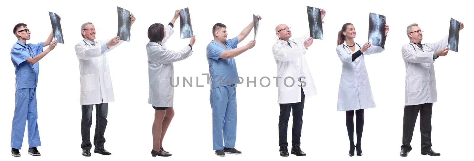 group of doctors holding x-ray isolated on white background