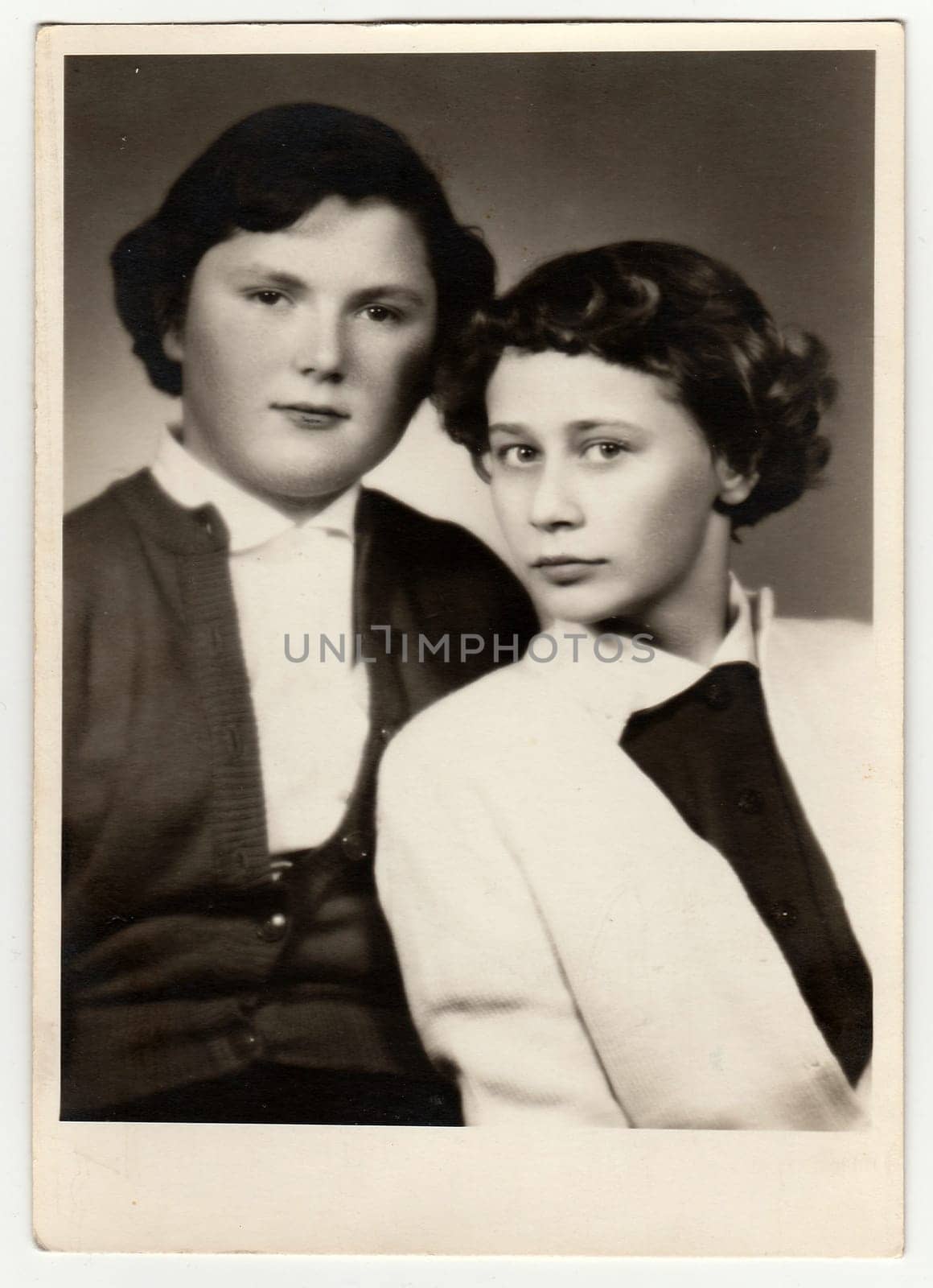 Vintage studio portrait photo shows young girls. Antique black white photo. by roman_nerud