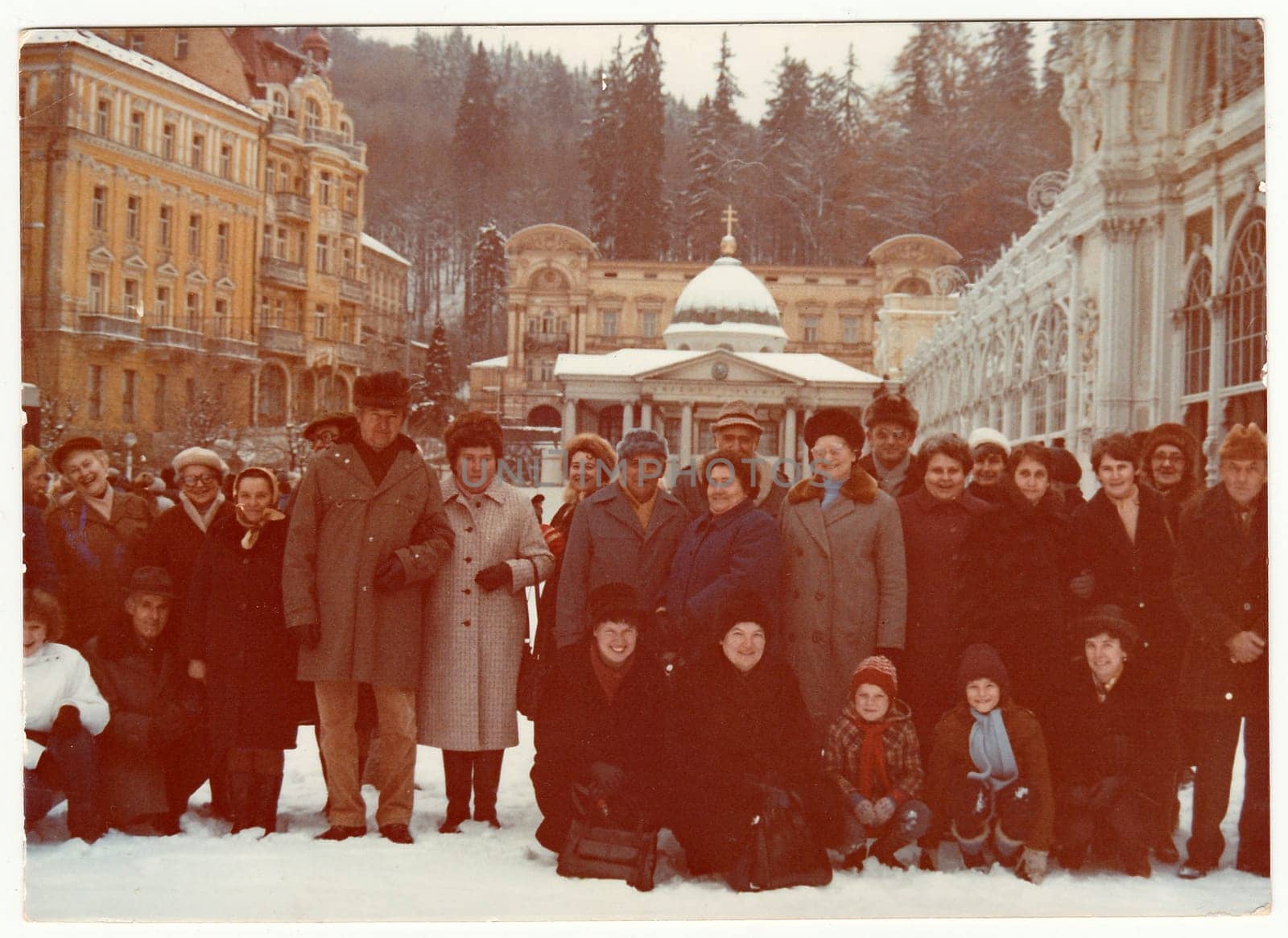Vintage photo shows group of people on winter vacation. by roman_nerud