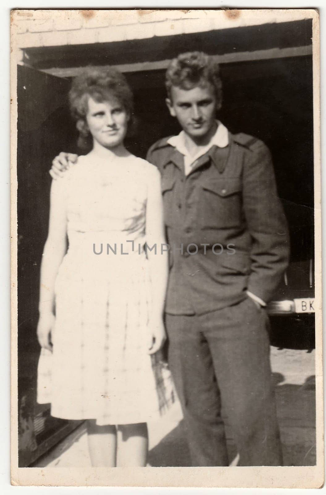 THE CZECHOSLOVAK SOCIALIST REPUBLIC - CIRCA 1950s: An antique Black & White photo shows soldier and his girlfriend.