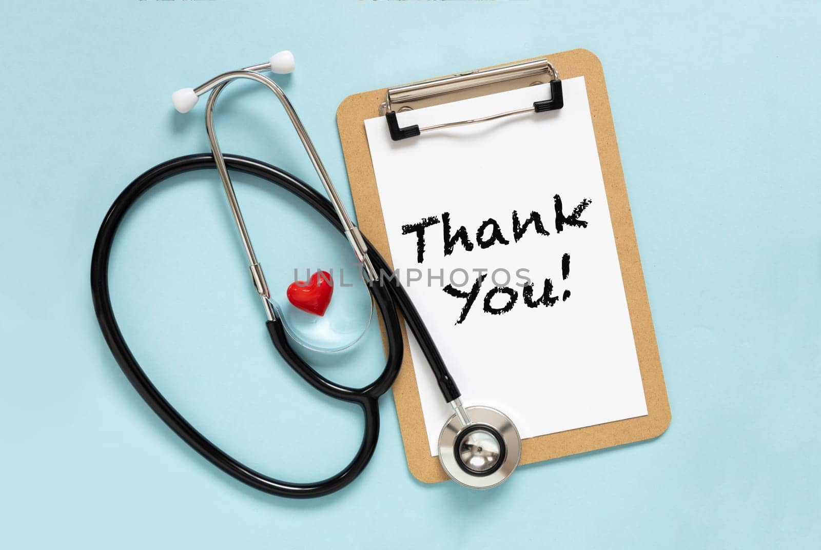 Text Thank you International nurses week concept. Congratulation for nurse day. Flat lay stethoscope, red heart on pastel blue background. by Ri6ka