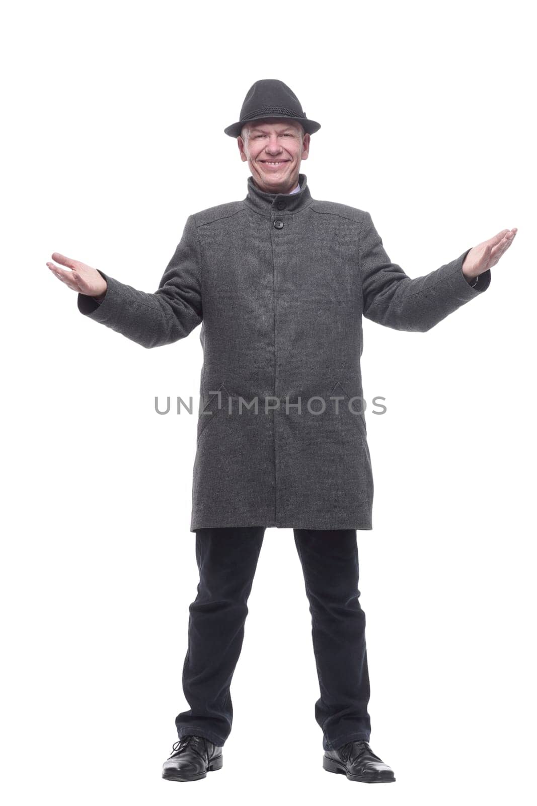 in full growth. intelligent man in a hat and autumn coat. isolated on a white background.