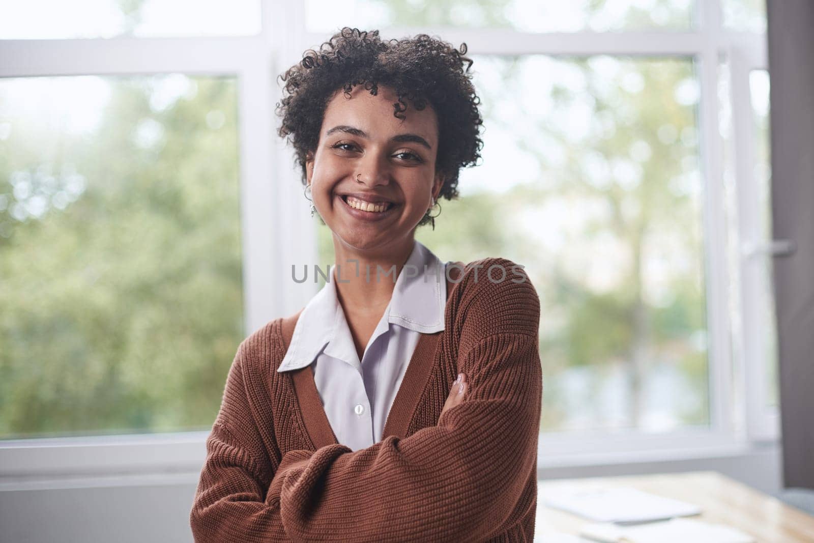 Young mixed race businesswoman smiling to camera