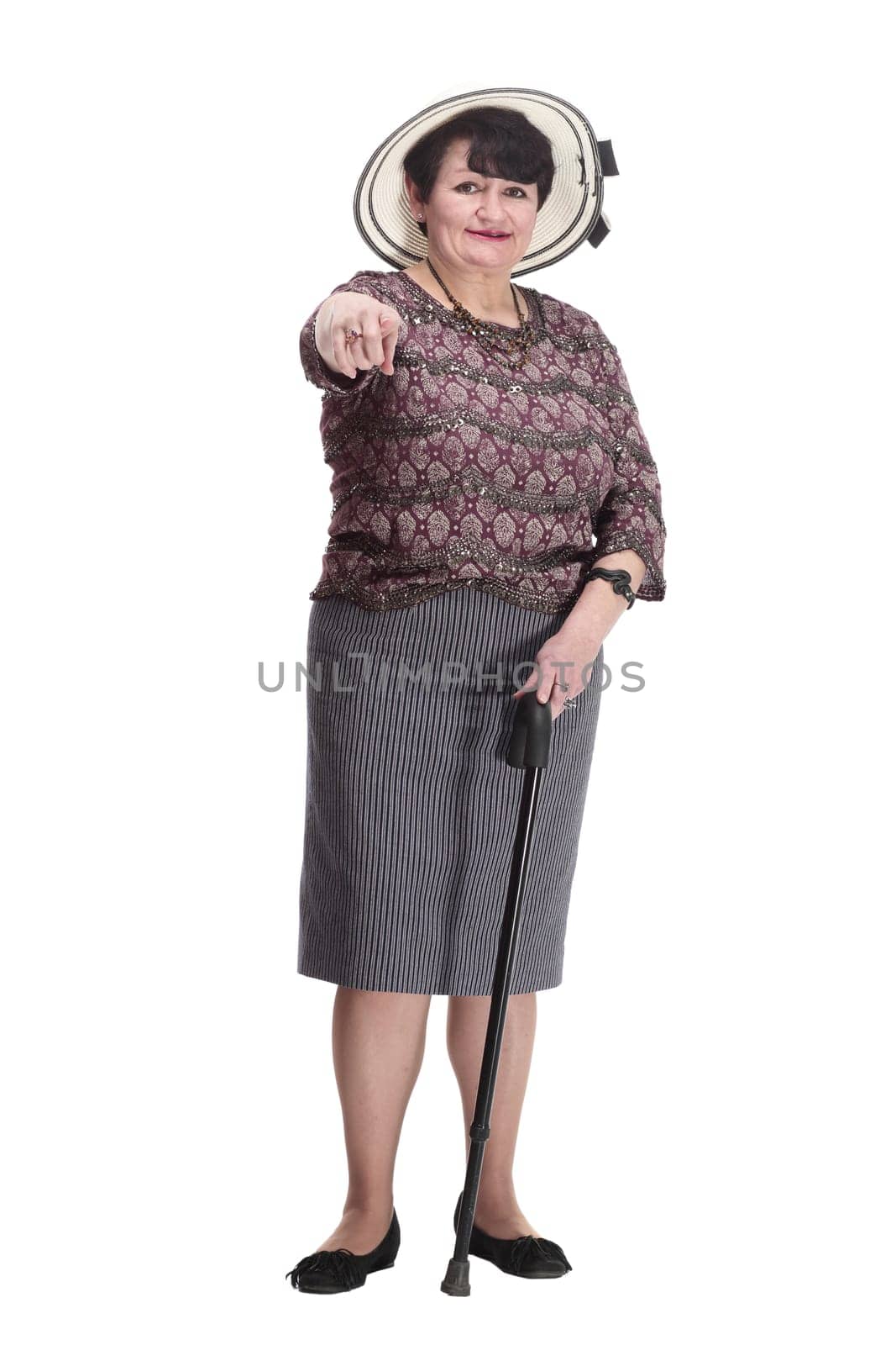 elderly woman in a summer hat giving a thumbs up. isolated on a white background.