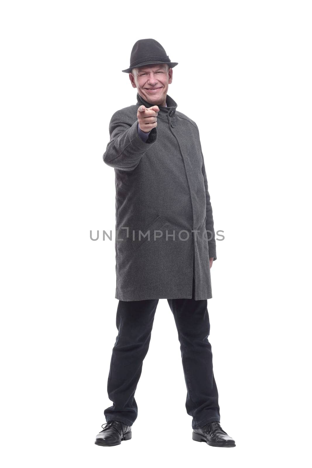 in full growth. intelligent man in a hat and autumn coat. isolated on a white background.