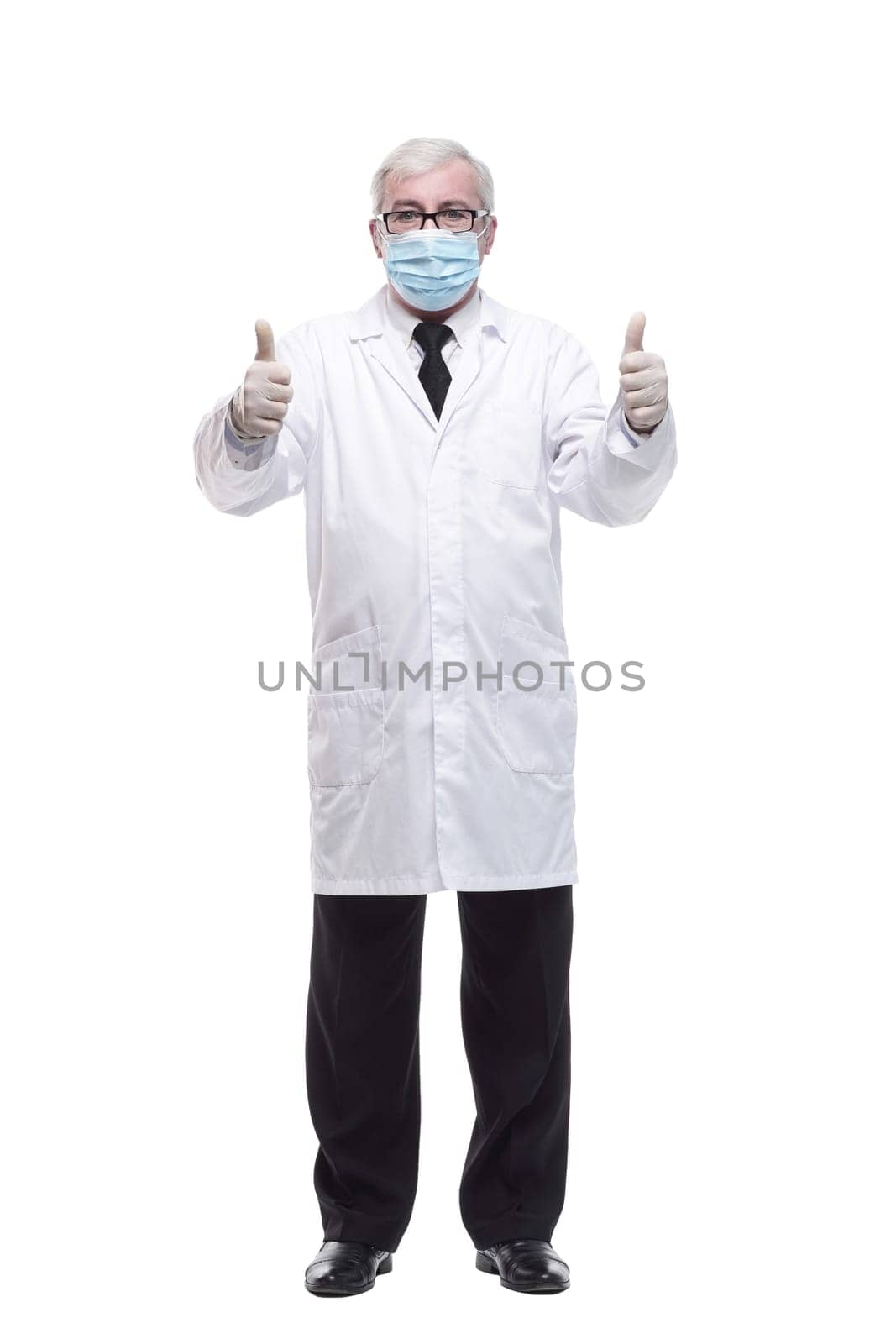 full-length. mature doctor in protective mask and gloves . isolated on a white background.
