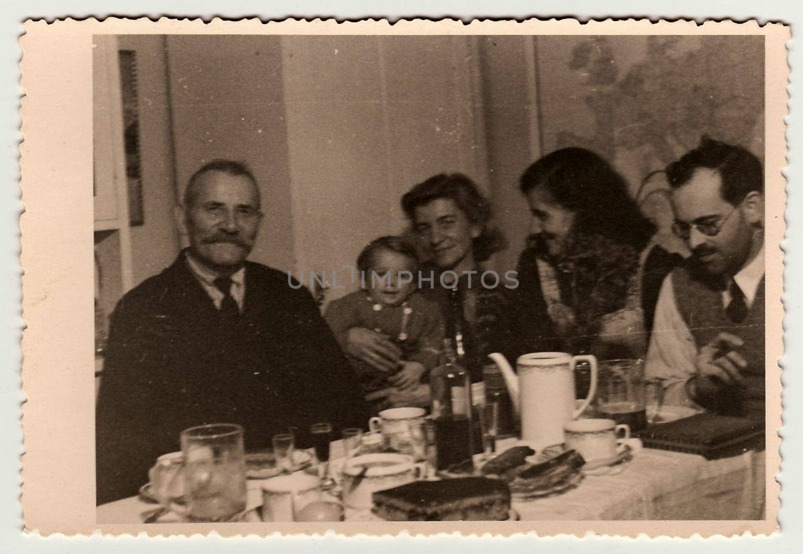 THE CZECHOSLOVAK REPUBLIC - CIRCA 1940s: Vintage photo shows family during the feast.