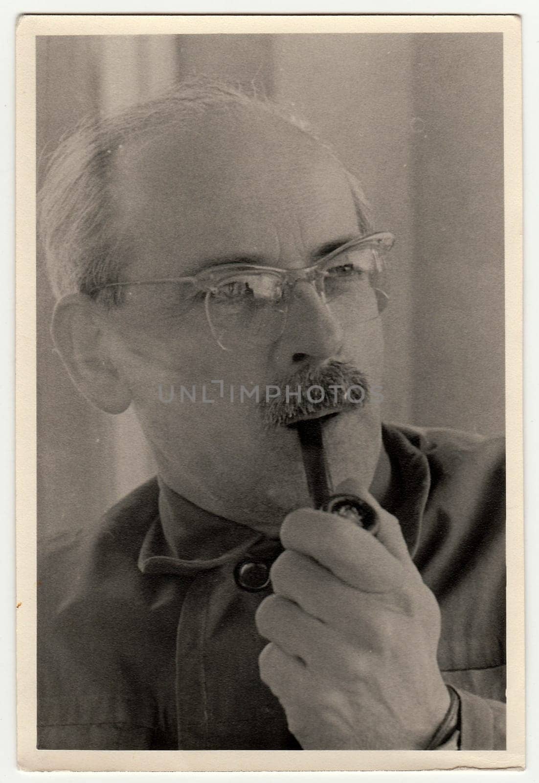 THE CZECHOSLOVAK SOCIALIST REPUBLIC - CIRCA 1950s: Vintage photo shows man with pipe.