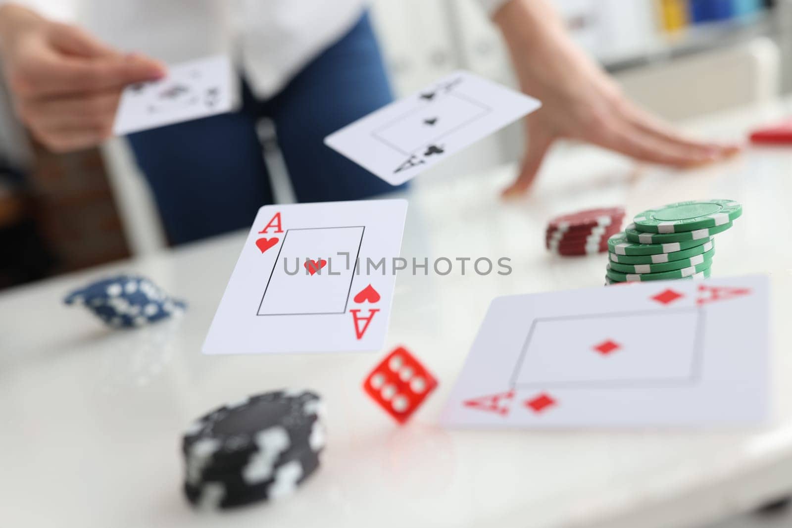 Poker player throws ace cards and casino chips by kuprevich
