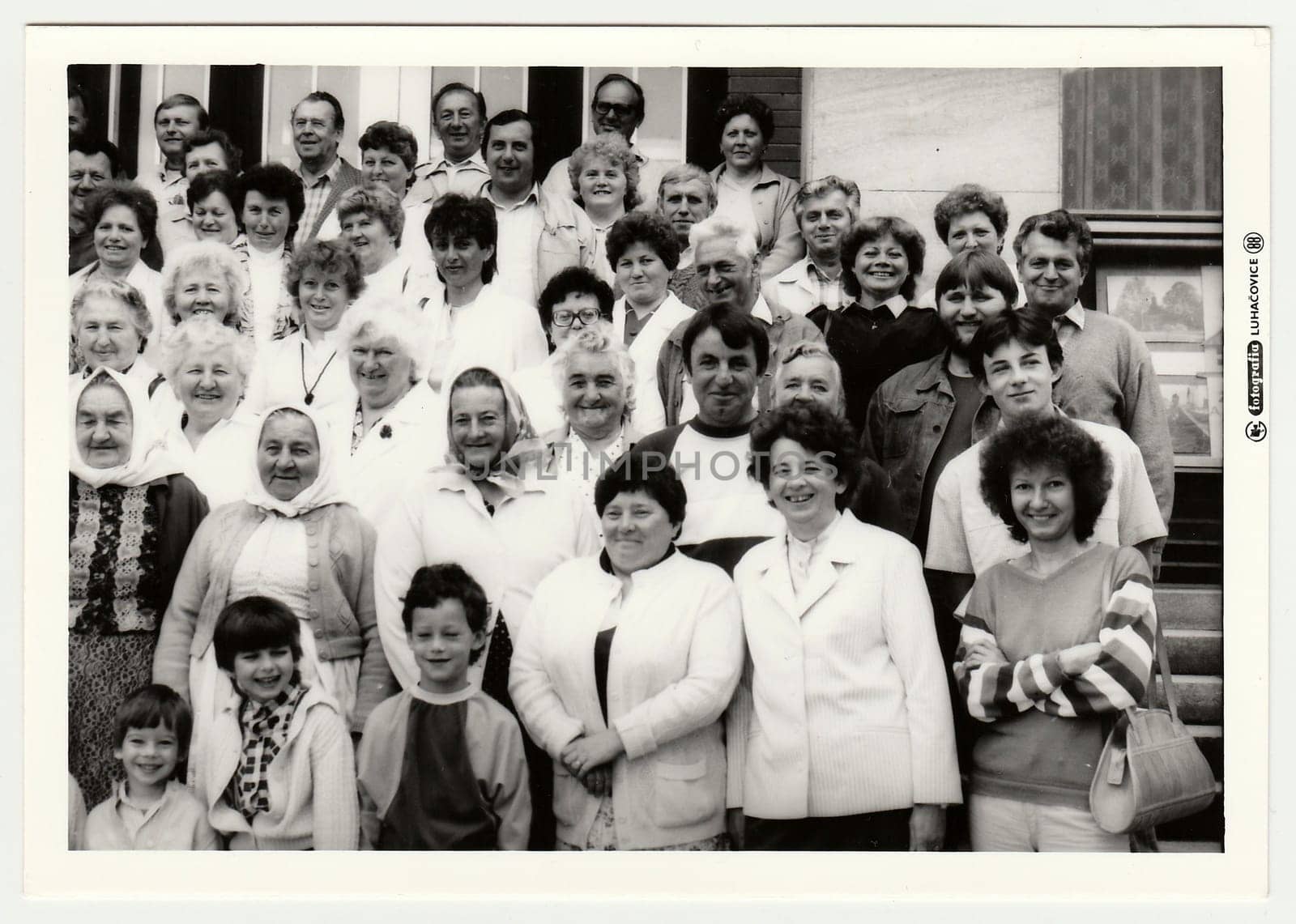 Vintage photo shows group of people on vacation. by roman_nerud