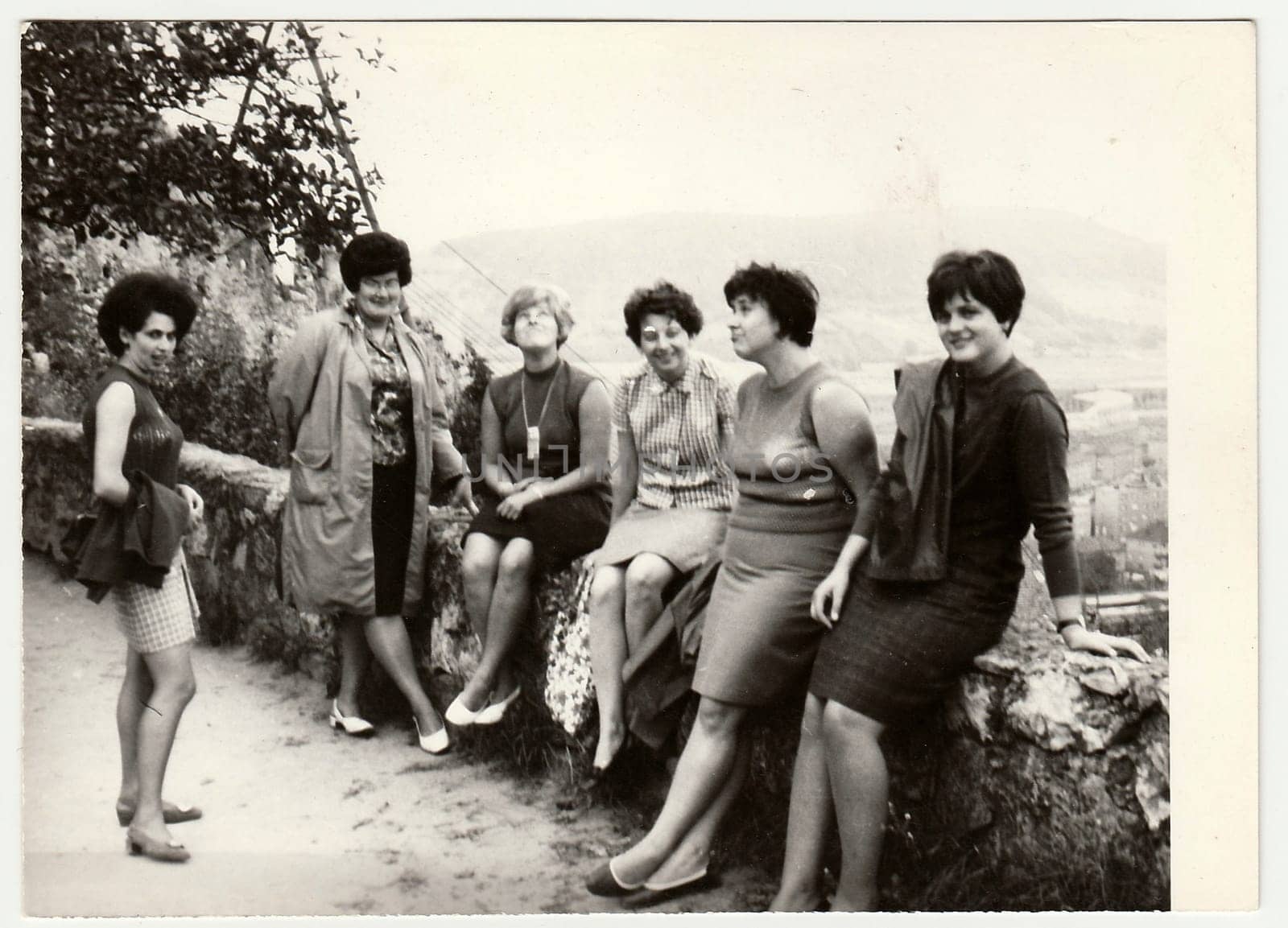 Vintage photo shows group of women on vacation. by roman_nerud