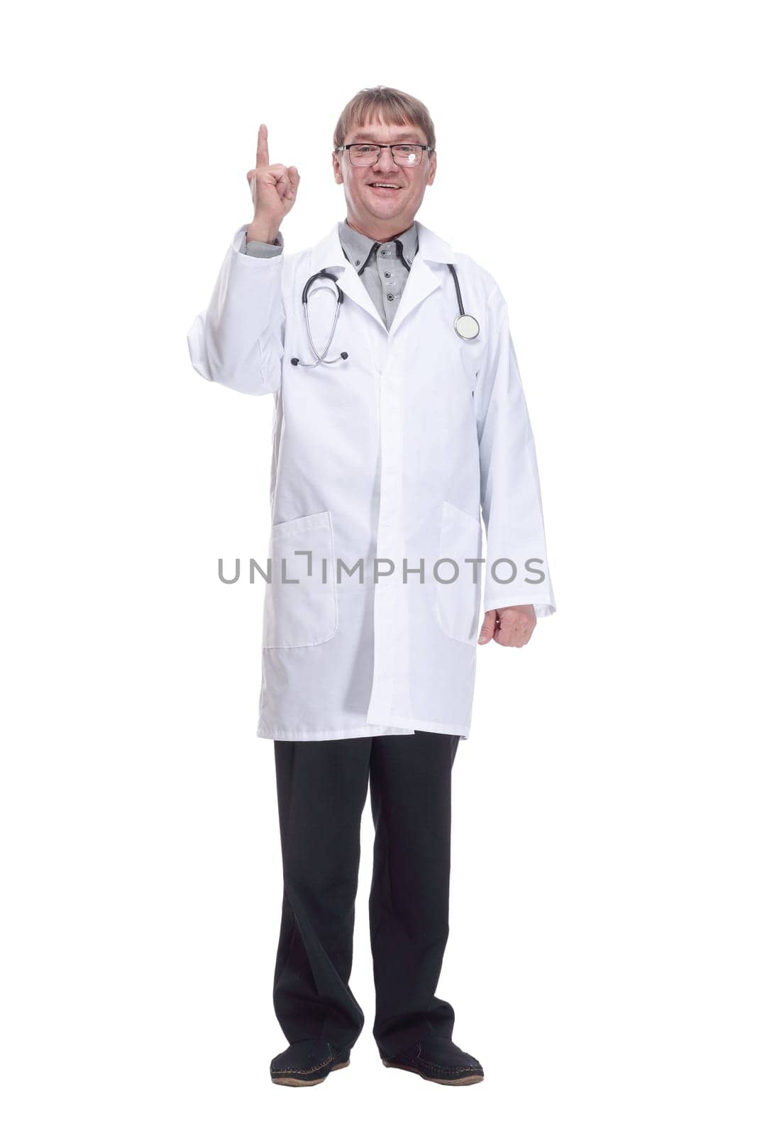 in full growth. successful male doctor with a stethoscope. isolated on a white background.