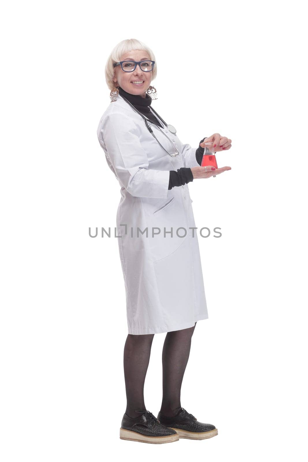 in full growth. female doctor with a laboratory flask. isolated on a white background.
