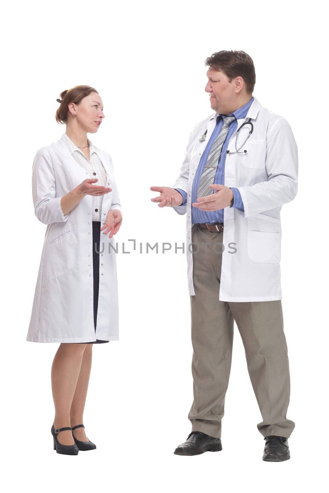 in full growth. medical colleagues standing together.isolated on a white background.