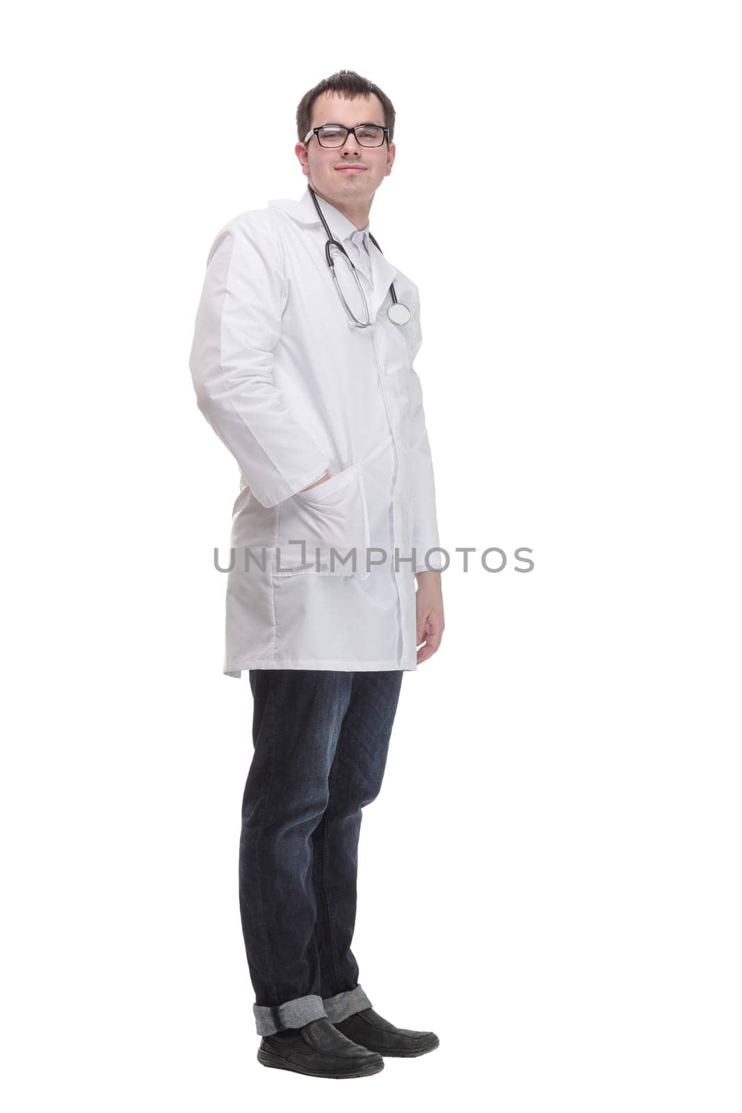 Young doctor man wearing white coat and stethoscope with smile on face, pointing with hand and finger to the side