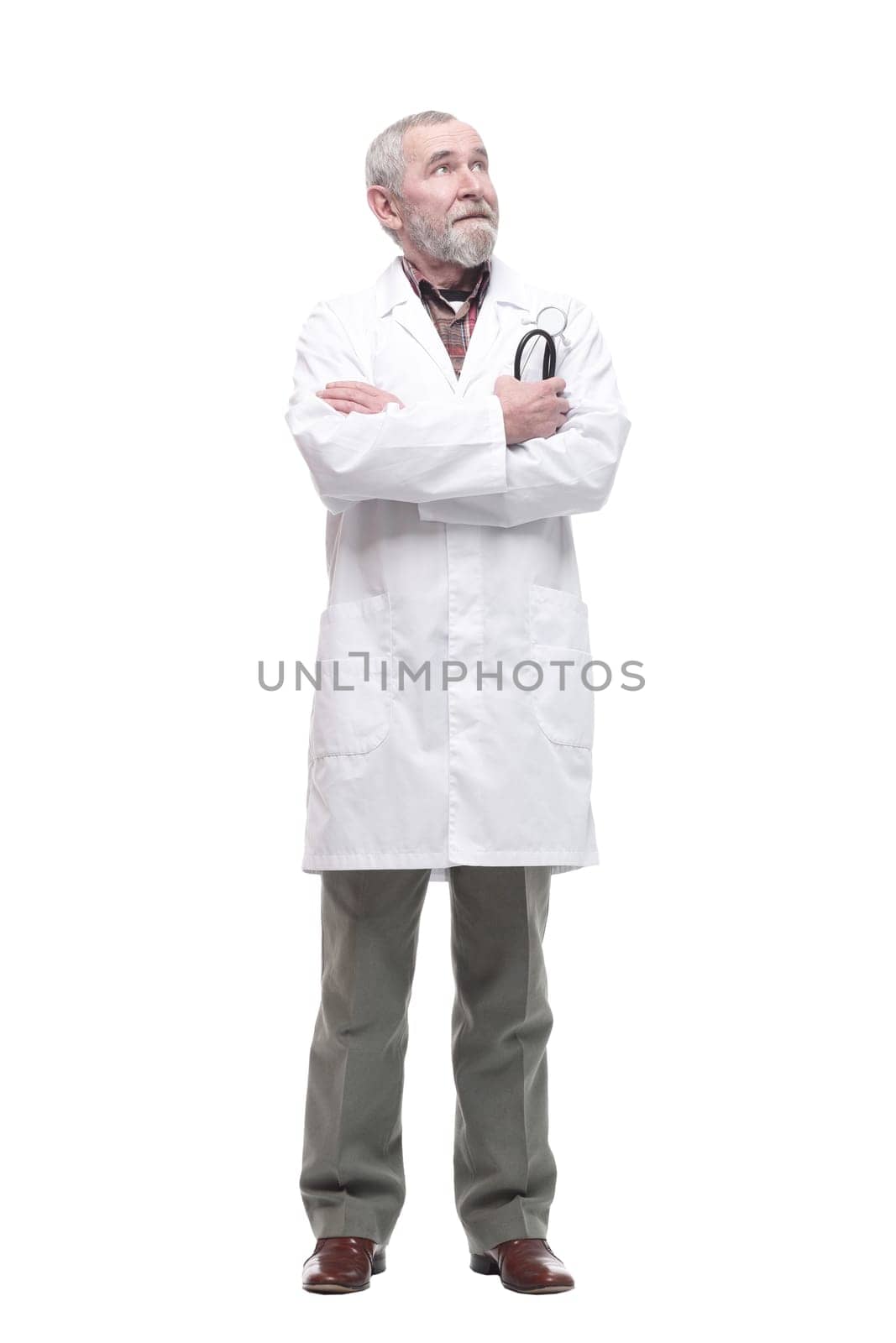 elderly competent doctor with a stethoscope in his hands. isolated on a white background.