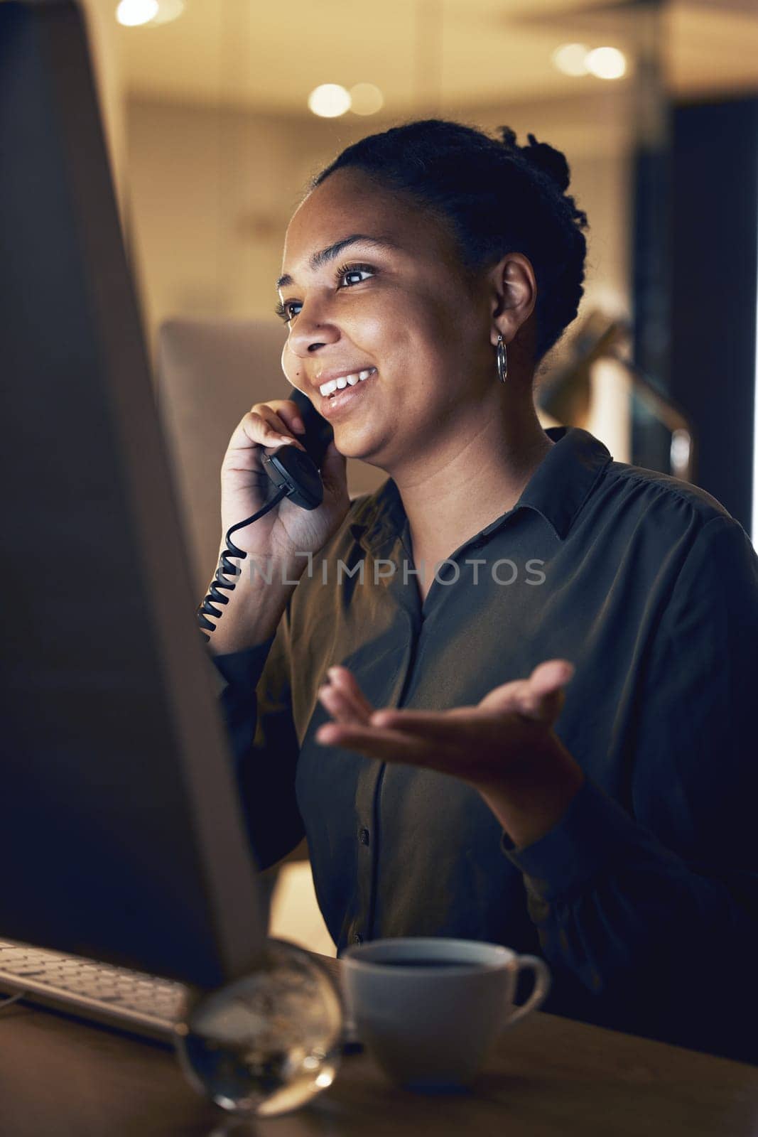 Overtime, night and businesswoman telephone call in an office working late evening in communication at the workplace. Young, computer and professional corporate employee or worker talking.