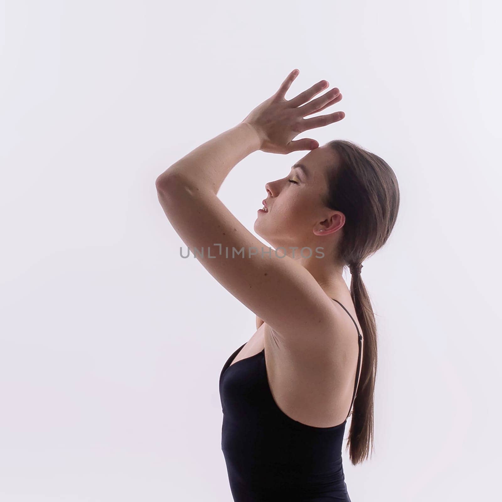 Athletic woman in swimsuit, doing yoga, push-ups, beautiful female exercising at studio by Zelenin