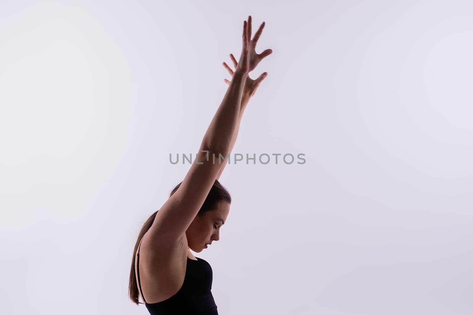 Athletic woman in swimsuit, doing yoga, push-ups, beautiful female exercising at studio by Zelenin