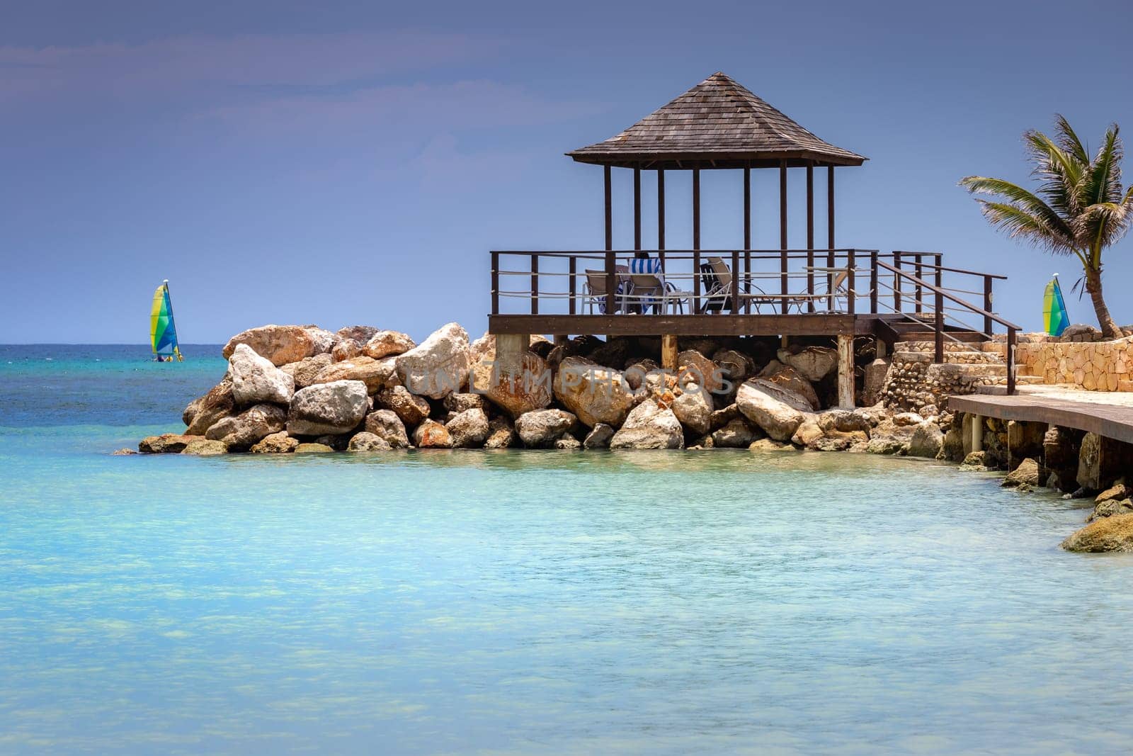 Tropical caribbean beach with turquoise waters in idyllic Montego Bay, Jamaica