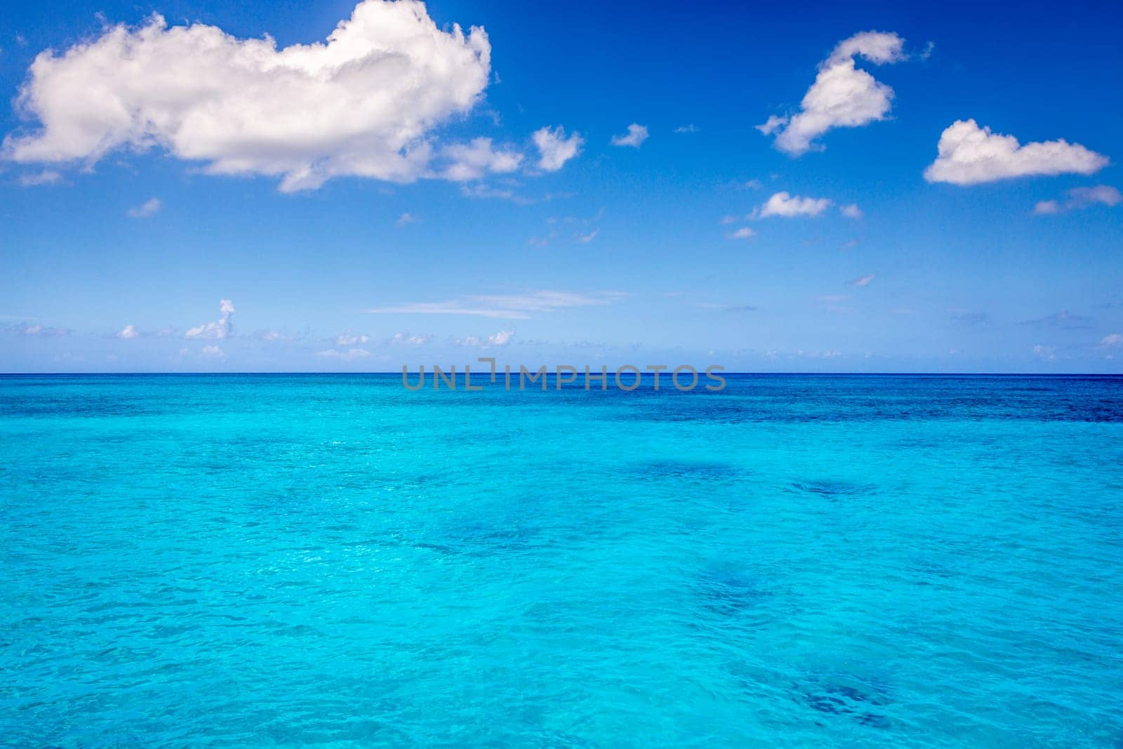 Blue sky and beautiful beach in Punta Cana at sunny day, Dominican Republic.