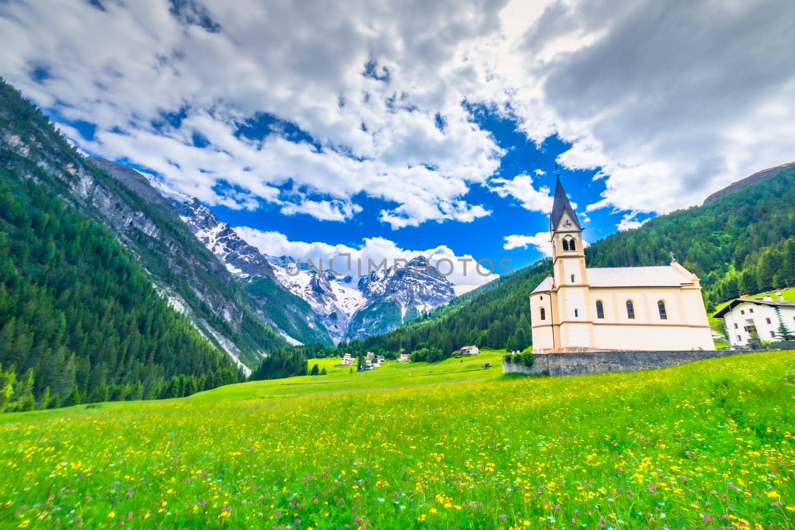 Idyllic village in Stelvio pass valley and Ortler massif, italian Dolomites at springtime, Italy