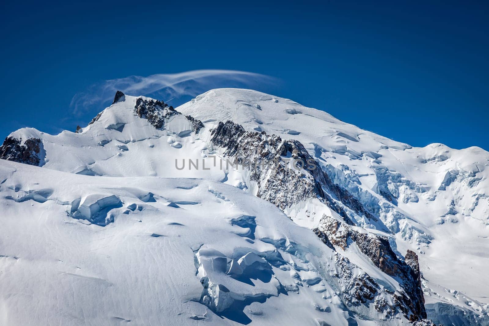 Mont blanc peak and massif, mountain climbing above glaciers, French Alps, France