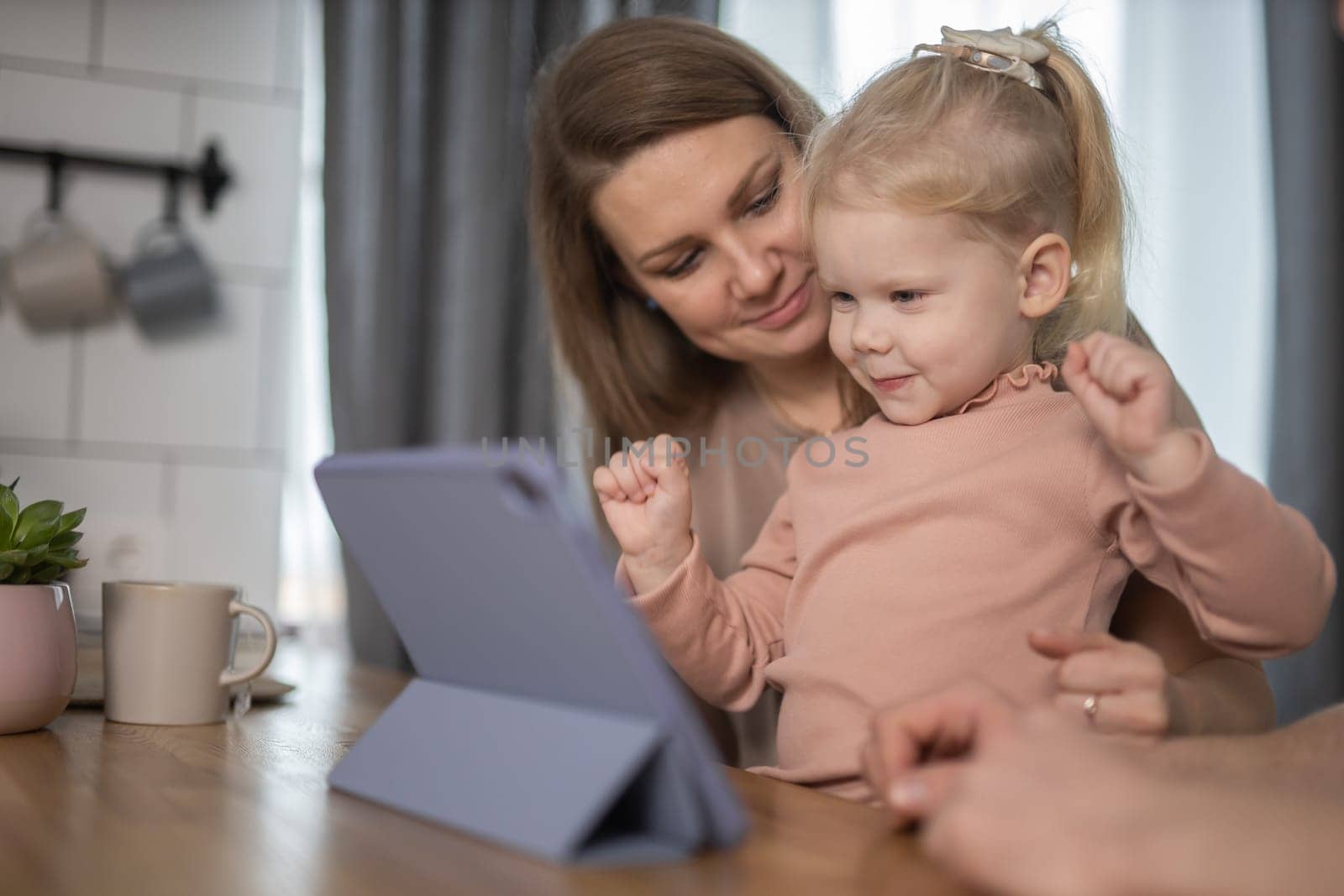 Deaf child girl with cochlear implant studying to hear sounds and have fun with mother - recovery after cochlear Implant surgery and rehabilitation concept by Satura86