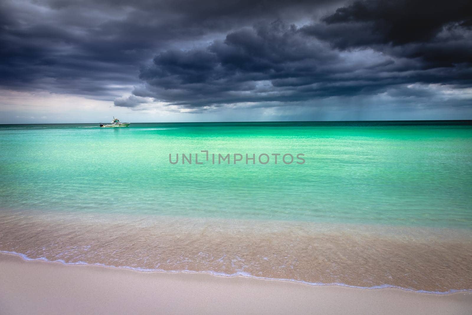 Tropical caribbean beach with storm clouds in Montego Bay, Jamaica by positivetravelart
