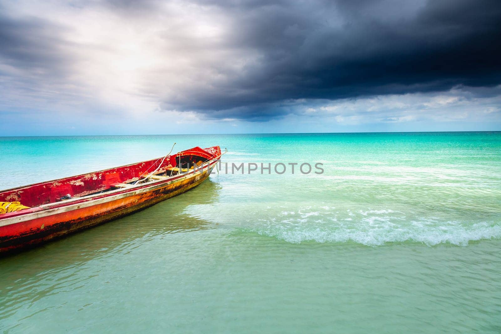 Tropical caribbean beach with storm clouds in idyllic Montego Bay, Jamaica