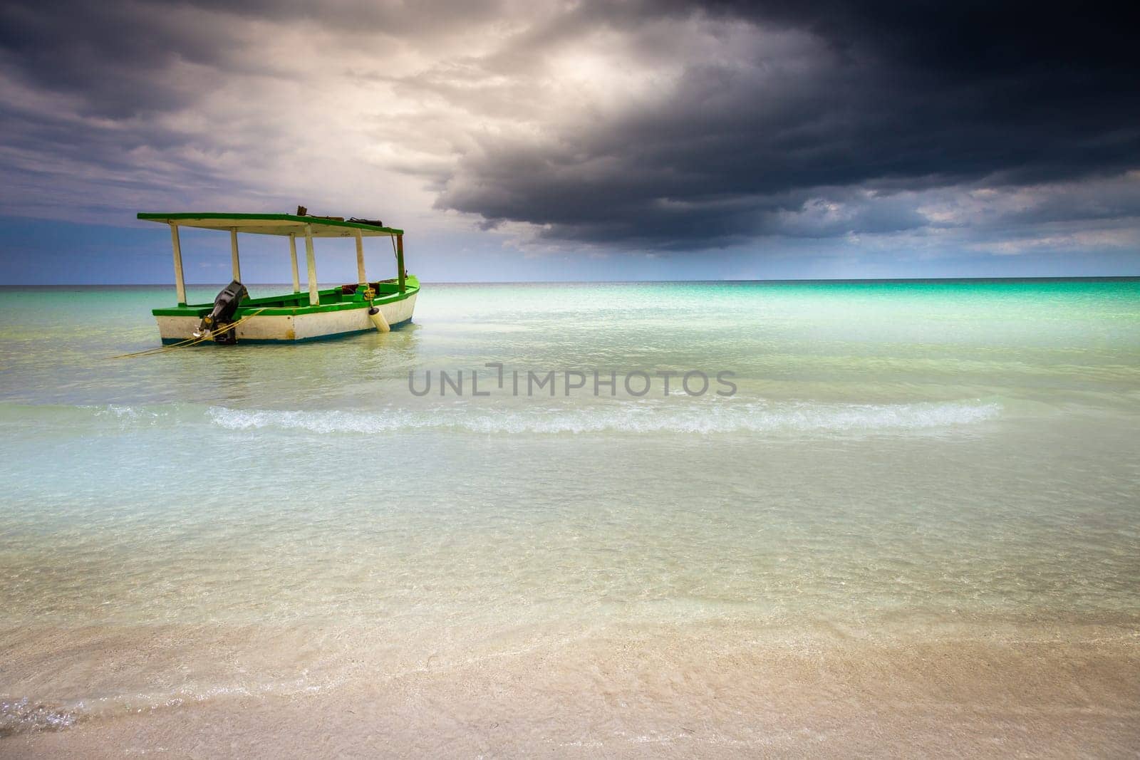 Tropical caribbean beach with storm clouds in idyllic Montego Bay, Jamaica