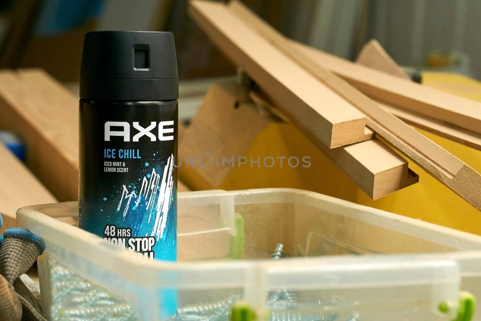 Kyiv, Ukraine. August 22,2022: Refreshing deodorant AXE in a carpentry workshop by jovani68