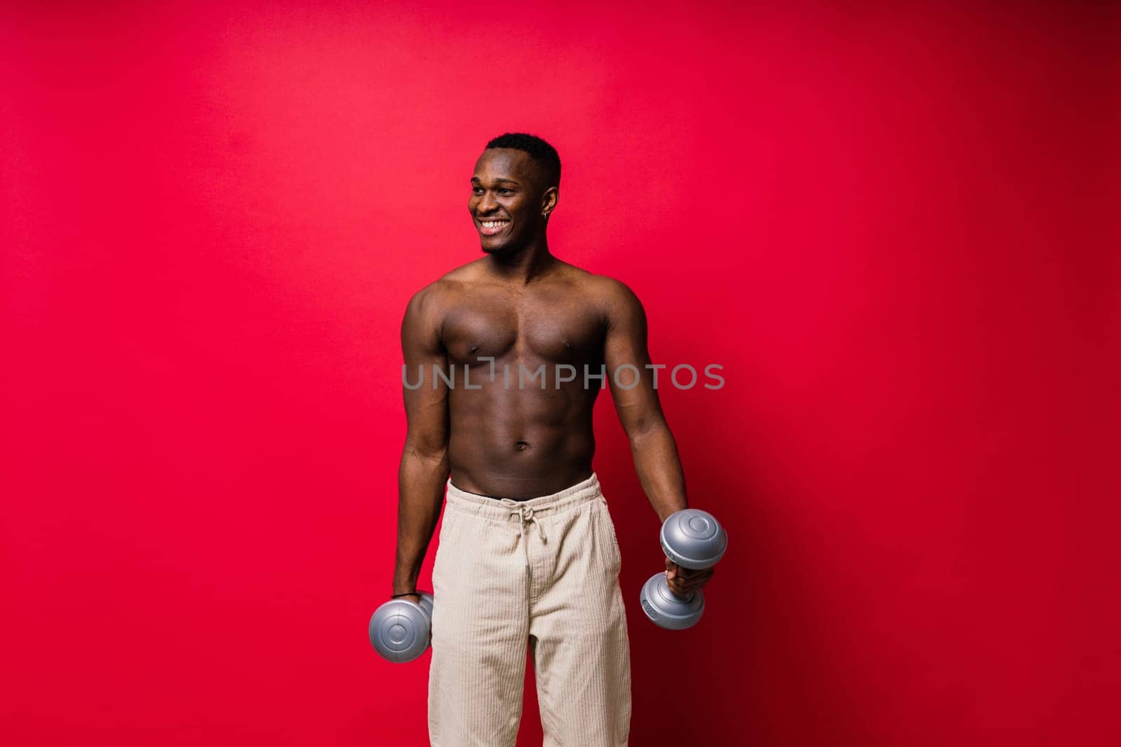 Muscular black african man with muscles abs abdominal, exercise determination and success
