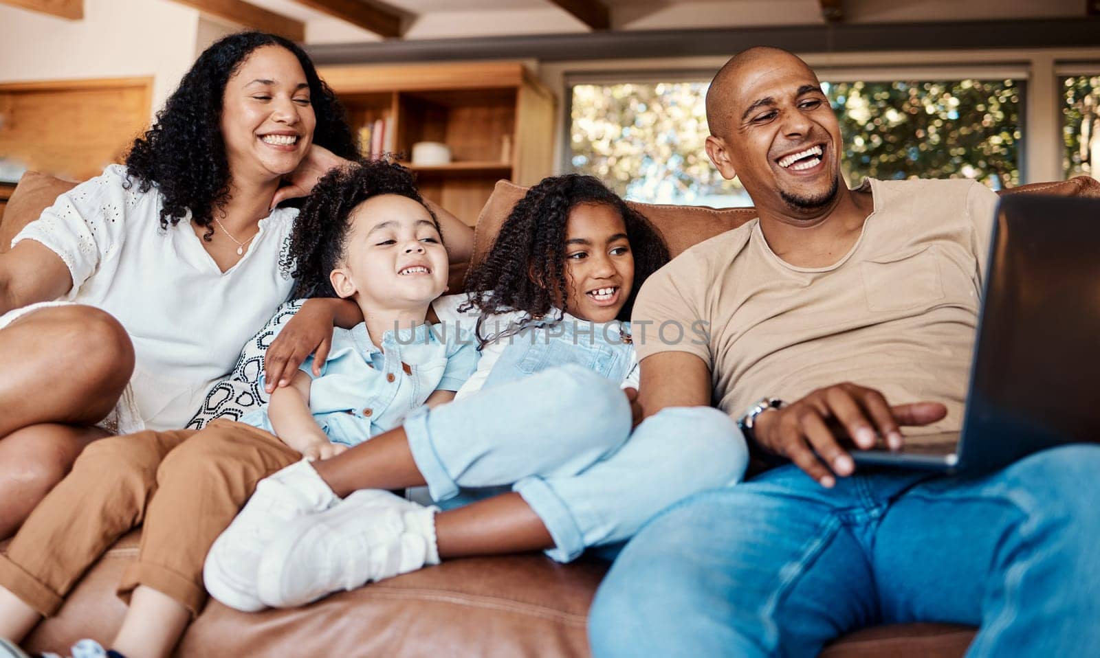 Laptop, happy family and kids with online video, movies or cartoon on couch on live streaming service, learning or bonding. Biracial mom, father and children watch film or show on computer and sofa by YuriArcurs