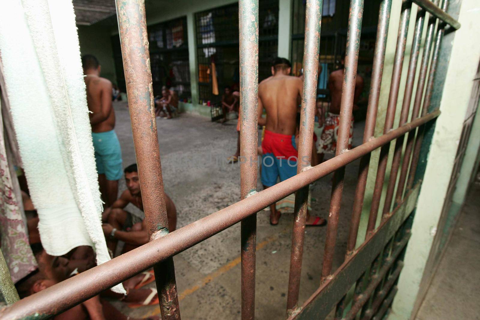 teixeira de freitas, bahia, brazil - november 24, 2009: detainees are seen in jail cells of the police complex in the city of teixeira de freitas.